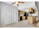 Well lit kitchen featuring wooden cabinets, black appliances, and a breakfast bar island at 105 Lotus Cir, Safety Harbor, FL 34695