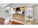 Kitchen with granite countertops, tiled floors, and adjacent dining area at 105 Lotus Cir, Safety Harbor, FL 34695