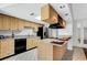 Kitchen island featuring granite countertops and stainless steel appliances at 105 Lotus Cir, Safety Harbor, FL 34695