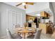 Cozy dining area next to the kitchen featuring a round table and seating for four at 105 Lotus Cir, Safety Harbor, FL 34695