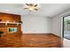 Open living room featuring a large fireplace and access to outdoor patio at 105 Lotus Cir, Safety Harbor, FL 34695