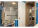 The bathroom features a glass-enclosed shower, toilet, and blue accents that add to the clean design at 1273 Mission Cir, Clearwater, FL 33759