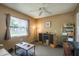 Bright bedroom with a ceiling fan, large window providing natural light, and versatile space for various uses at 1273 Mission Cir, Clearwater, FL 33759