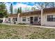 Well-kept townhomes featuring manicured lawns and cozy front patios with seating at 1273 Mission Cir, Clearwater, FL 33759