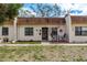 Charming townhome with neutral exterior, covered porch, and well-maintained landscaping at 1273 Mission Cir, Clearwater, FL 33759