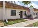Inviting townhome showcasing a charming front patio, neat landscaping, and a welcoming entrance at 1273 Mission Cir, Clearwater, FL 33759