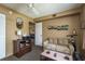 Comfortable living room with tan walls, a neutral sofa, a ceiling fan, and contemporary decor elements at 1273 Mission Cir, Clearwater, FL 33759