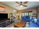 Cozy living room leading to dining area and bedroom, filled with natural light at 1273 Mission Cir, Clearwater, FL 33759