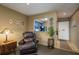 Comfortable living room showcasing a pass-through to the kitchen area and a cozy armchair at 1273 Mission Cir, Clearwater, FL 33759