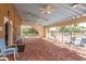 Covered patio with seating near the pool, creating a relaxing outdoor lounge area at 1273 Mission Cir, Clearwater, FL 33759