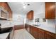 Bright kitchen with stainless steel appliances and wood cabinetry at 1540 Walnut St, Clearwater, FL 33755