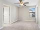 Bedroom featuring neutral walls, plush carpet, window with blinds, and ceiling fan at 1598 Tallulah Ter, Wesley Chapel, FL 33543