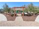 Community playground with a green slide and bordered by a wooden fence at 1598 Tallulah Ter, Wesley Chapel, FL 33543