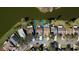 Aerial view of a lakeside property with a well-maintained yard, and neighborhood with community pool at 1731 Elk Spring Dr, Brandon, FL 33511