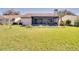 Sprawling backyard featuring a covered lanai, providing an ideal space for relaxation at 1731 Elk Spring Dr, Brandon, FL 33511