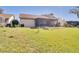 Expansive backyard featuring a screened-in lanai and lush lawn, perfect for outdoor living at 1731 Elk Spring Dr, Brandon, FL 33511