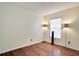 This empty bedroom features hardwood floors, neutral walls and natural light from the window with blinds at 1731 Elk Spring Dr, Brandon, FL 33511