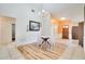 Bright dining area features modern chandelier, decorative wall art and clear acrylic chairs at 1731 Elk Spring Dr, Brandon, FL 33511