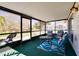 Enclosed lanai featuring comfortable seating and scenic backyard water views at 1731 Elk Spring Dr, Brandon, FL 33511