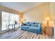 The living room features wood floors, neutral tones, and natural light streaming through a window at 1731 Elk Spring Dr, Brandon, FL 33511