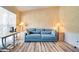The living room features wood floors, neutral tones, and natural light streaming through a window at 1731 Elk Spring Dr, Brandon, FL 33511