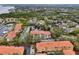 Expansive aerial view of the residential area with community amenities and lush greenery around well-maintained condominium buildings at 1800 Mariner Dr # 9, Tarpon Springs, FL 34689