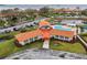 Aerial view featuring the community center with pool and manicured landscaping at 1800 Mariner Dr # 9, Tarpon Springs, FL 34689