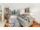 Bright living room with hardwood floors, neutral decor, and view of lake at 1800 Mariner Dr # 9, Tarpon Springs, FL 34689