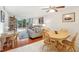 Open-concept living and dining area with tiled floors and lots of natural light at 1800 Mariner Dr # 9, Tarpon Springs, FL 34689