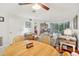 Open-concept living and dining area with tile floors and lots of natural light at 1800 Mariner Dr # 9, Tarpon Springs, FL 34689