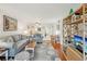 Spacious living room with hardwood floors and neutral-toned furniture at 1800 Mariner Dr # 9, Tarpon Springs, FL 34689