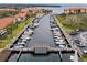 Scenic marina view featuring boats docked along piers, surrounded by lush landscaping and residential buildings at 1800 Mariner Dr # 9, Tarpon Springs, FL 34689