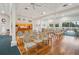 Open-concept meeting room with a full kitchen, tables, and rows of chairs for large events and activities for residents to enjoy at 1800 Mariner Dr # 9, Tarpon Springs, FL 34689
