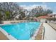 Enjoy the sparkling swimming pool surrounded by lush trees and lounging areas at 1800 Mariner Dr # 9, Tarpon Springs, FL 34689
