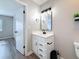 Bathroom has a new vanity with black fixtures and a large mirror at 1884 Clearbrooke Dr # 1884, Clearwater, FL 33760