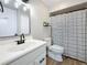 Bathroom features a new vanity, black fixtures, and black and white shower curtain at 1884 Clearbrooke Dr # 1884, Clearwater, FL 33760
