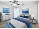Stylishly furnished bedroom featuring a comfortable bed, a ceiling fan, and tranquil decor at 1884 Clearbrooke Dr # 1884, Clearwater, FL 33760