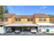 Townhomes feature carports and yellow-painted exteriors at 1884 Clearbrooke Dr # 1884, Clearwater, FL 33760