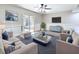 Comfortable living room featuring modern furniture, decor and a sliding door to the patio at 1884 Clearbrooke Dr # 1884, Clearwater, FL 33760