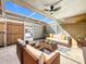 Cozy covered patio perfect for relaxing and entertaining, featuring comfortable seating and neutral decor at 1884 Clearbrooke Dr # 1884, Clearwater, FL 33760