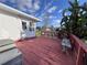 Exterior view of a home featuring a deck and tropical plants at 2331 Belleair Rd # 527, Clearwater, FL 33764