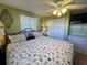 Bright bedroom with a ceiling fan, closet, and plenty of natural light at 2331 Belleair Rd # 527, Clearwater, FL 33764