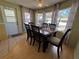 Cozy dining room with a wood table, chairs, and natural light at 2331 Belleair Rd # 527, Clearwater, FL 33764