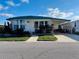Charming single-story home with a covered carport and well-maintained landscaping at 2331 Belleair Rd # 527, Clearwater, FL 33764