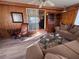 Open living area with comfortable seating and wood accents, leading to an outdoor space at 2331 Belleair Rd # 527, Clearwater, FL 33764
