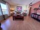 Bright living room with a comfortable sofa, decorative lamps, and a coffee table at 2331 Belleair Rd # 527, Clearwater, FL 33764