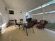 Covered patio with a table, chairs, and grill at 2331 Belleair Rd # 527, Clearwater, FL 33764