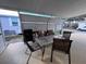 Covered patio with a grill, table, and chairs at 2331 Belleair Rd # 527, Clearwater, FL 33764