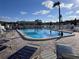 Community pool offers lounge chairs, umbrellas, and clear blue water for relaxation and enjoyment at 2331 Belleair Rd # 527, Clearwater, FL 33764