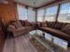 Cozy sunroom featuring comfortable seating, a glass coffee table, and lots of windows at 2331 Belleair Rd # 527, Clearwater, FL 33764